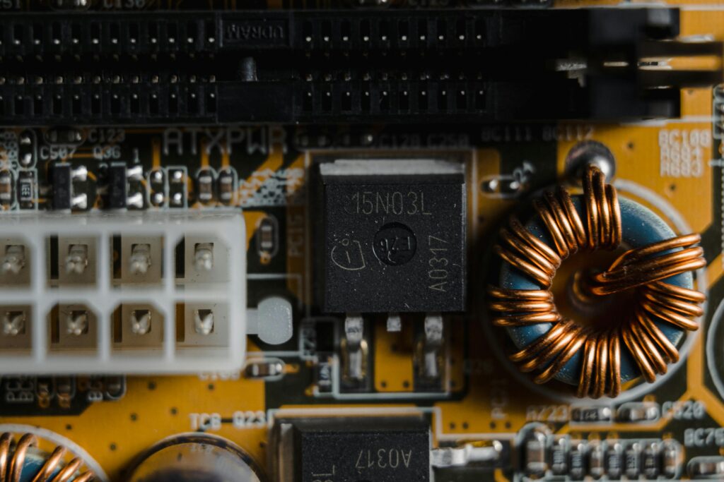 pexels-photo-6755141-6755141 Detailed close-up of electronic components on a circuit board, showcasing intricate engineering.